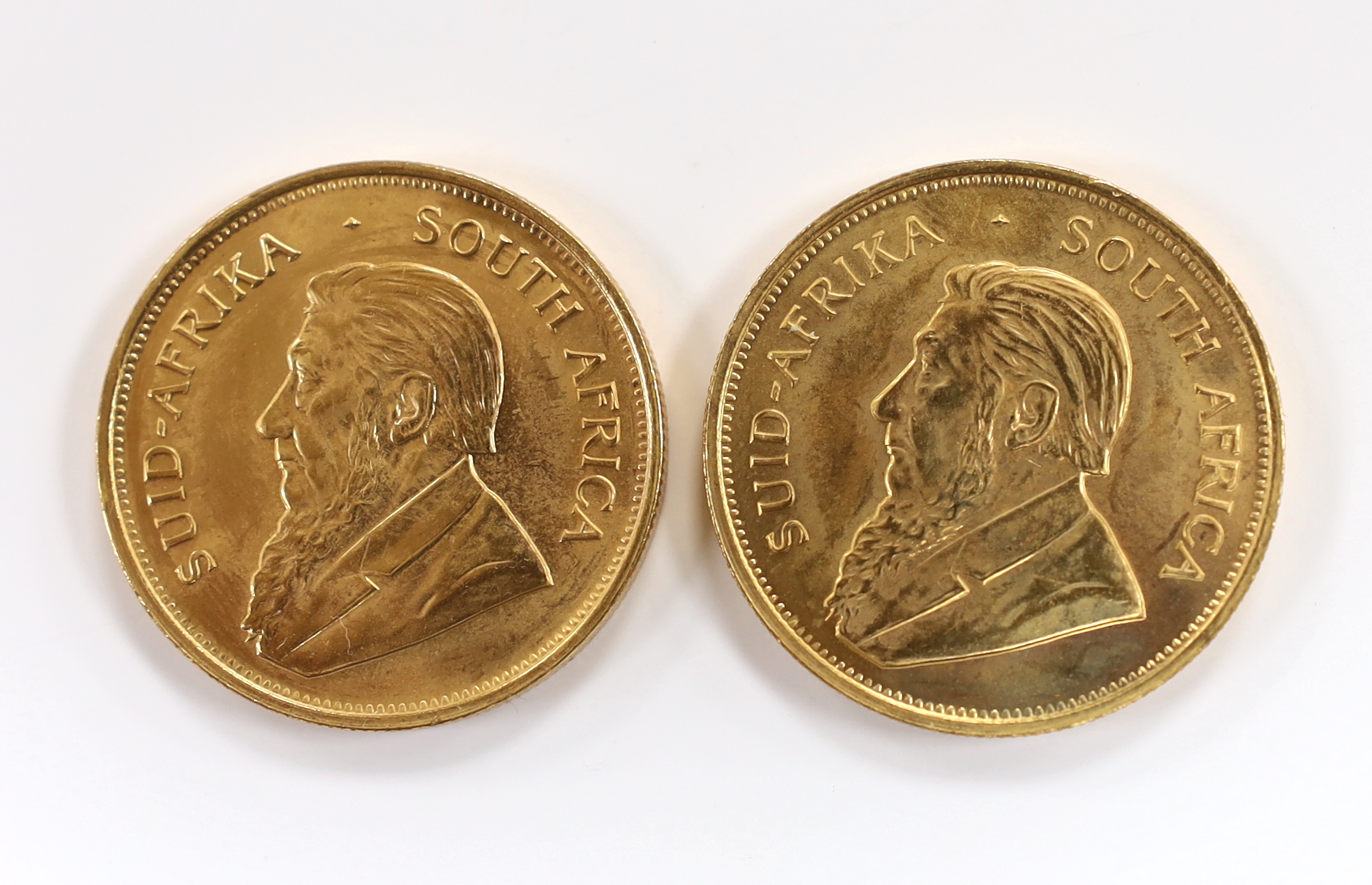 Gold coins, South Africa, two gold 1oz. Krugerrands, 1975, near UNC (2oz.)